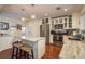 Stylish kitchen featuring stainless steel appliances, marble countertops and a kitchen island at 476 Rebstock Blvd, Palm Harbor, FL 34683