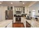 Bright kitchen with stainless steel appliances, marble countertops, and white cabinetry at 476 Rebstock Blvd, Palm Harbor, FL 34683