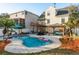 Backyard pool area featuring outdoor seating, covered gazebo and nice landscaping at 476 Rebstock Blvd, Palm Harbor, FL 34683