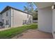 Backyard of house with stucco walls and a patio at 5162 Sunridge Palms Dr # 5162, Tampa, FL 33617