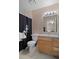 Standard bathroom with single vanity, toilet, swan-themed shower curtain and neutral color palette at 5162 Sunridge Palms Dr # 5162, Tampa, FL 33617