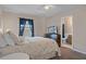 Bedroom featuring a queen bed, TV on dresser, and ensuite bathroom at 5162 Sunridge Palms Dr # 5162, Tampa, FL 33617