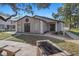 Community clubhouse with charcoal grill and walkway, with mature trees at 5162 Sunridge Palms Dr # 5162, Tampa, FL 33617
