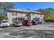 Exterior of a two-story townhome with ample parking and mature trees at 5162 Sunridge Palms Dr # 5162, Tampa, FL 33617