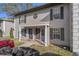 Two-story townhome featuring a covered entry, neutral paint, and black shutters at 5162 Sunridge Palms Dr # 5162, Tampa, FL 33617