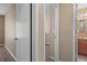 Hallway featuring doorways, neutral walls, and carpeted flooring leading into the main rooms at 5162 Sunridge Palms Dr # 5162, Tampa, FL 33617
