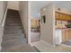 Open-concept floor plan with stairs, living room, and kitchen area at 5162 Sunridge Palms Dr # 5162, Tampa, FL 33617