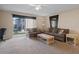 Comfortable living room with a ceiling fan and sliding glass doors leading to the outside at 5162 Sunridge Palms Dr # 5162, Tampa, FL 33617