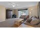 Spacious living room with plush seating, desk, and large windows at 5162 Sunridge Palms Dr # 5162, Tampa, FL 33617