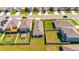 An aerial shot of a neighborhood showcases well-kept lawns, fenced yards, and houses with neat landscaping at 5617 Flagstone Trl, Palmetto, FL 34221