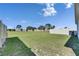 Spacious backyard with lush green grass and privacy fence, perfect for outdoor activities and relaxation at 5617 Flagstone Trl, Palmetto, FL 34221
