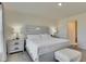 Bedroom with neutral colors, plush carpeting, and a view of a closet and bathroom at 5617 Flagstone Trl, Palmetto, FL 34221