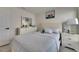 Inviting bedroom featuring a comfortable queen bed, dresser, and charming decor at 5617 Flagstone Trl, Palmetto, FL 34221