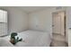 Comfortable bedroom features plush carpeting, a window, and a view of a closet and bathroom at 5617 Flagstone Trl, Palmetto, FL 34221