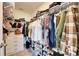 Walk-in closet with clothing racks, shelves, and built-in drawers for ample storage at 5617 Flagstone Trl, Palmetto, FL 34221