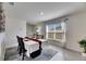 Sunlit dining area showcases a modern table setting with a window view at 5617 Flagstone Trl, Palmetto, FL 34221