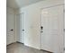 Bright entryway features white doors and neutral wall paint at 5617 Flagstone Trl, Palmetto, FL 34221