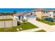 Attractive single-story home featuring a two-car garage, green lawn, and classic white exterior at 5617 Flagstone Trl, Palmetto, FL 34221