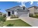 Charming single-story home with a two-car garage and well-maintained landscaping at 5617 Flagstone Trl, Palmetto, FL 34221