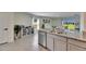 Bright kitchen with granite countertops, stainless steel appliances and tile flooring at 5617 Flagstone Trl, Palmetto, FL 34221