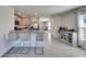Open concept view of the kitchen and living room, complete with granite countertop seating at 5617 Flagstone Trl, Palmetto, FL 34221