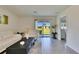 Well-lit living room with access to outdoor space through sliding glass doors at 5617 Flagstone Trl, Palmetto, FL 34221