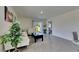 Modern living room featuring a large window, white furniture, and tile flooring at 5617 Flagstone Trl, Palmetto, FL 34221