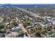 An aerial shot of the neighborhood, showing tree-lined streets and surrounding residential areas at 6002 N Branch Ave, Tampa, FL 33604