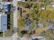 Aerial view of the home showcasing a backyard and neighborhood from above at 6002 N Branch Ave, Tampa, FL 33604