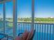 Enjoy tranquil water views from this balcony featuring comfortable seating and serene atmosphere at 6401 99Th N Way # 15C, St Petersburg, FL 33708