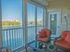 Enclosed balcony featuring comfortable seating and offering stunning water views at 6401 99Th N Way # 15C, St Petersburg, FL 33708