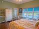 Bedroom features a bright and sunny window that overlooks the lake at 6401 99Th N Way # 15C, St Petersburg, FL 33708