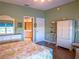 This bedroom features an ensuite bath and a large mirrored dresser at 6401 99Th N Way # 15C, St Petersburg, FL 33708