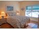 The bright bedroom has great light and decorative lamps on nightstands at 6401 99Th N Way # 15C, St Petersburg, FL 33708