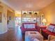 Cozy living room with two couches, an ottoman, a view of the dining room and a glimpse of the entryway at 6401 99Th N Way # 15C, St Petersburg, FL 33708