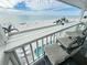Beautiful balcony featuring a white bar top and chairs overlooking the beach at 712 Beach Trl # C, Indian Rocks Beach, FL 33785