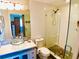 Modern bathroom with glass shower and granite sink at 712 Beach Trl # C, Indian Rocks Beach, FL 33785