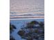 Beach view with pink chair overlooking the ocean at 712 Beach Trl # C, Indian Rocks Beach, FL 33785