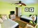 This bedroom features two twin beds and a ceiling fan at 712 Beach Trl # C, Indian Rocks Beach, FL 33785