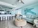 Open concept living area with bar seating and coastal decor at 712 Beach Trl # C, Indian Rocks Beach, FL 33785