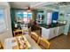 Inviting living space with dining area, fully equipped kitchen, comfortable seating, and ocean views at 712 Beach Trl # C, Indian Rocks Beach, FL 33785