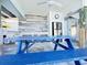 Outdoor kitchen with stainless steel refrigerator and sink with backsplash at 712 Beach Trl # C, Indian Rocks Beach, FL 33785