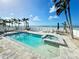 Backyard pool with lounge chairs overlooking the ocean at 712 Beach Trl # C, Indian Rocks Beach, FL 33785