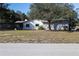 The back exterior has a screened in patio area at 8436 Cameo St, Spring Hill, FL 34608
