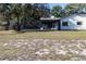 View of the screened-in patio and backyard at 8436 Cameo St, Spring Hill, FL 34608