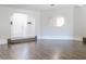 Spacious living room showcasing hardwood floors, archway, and bright natural light at 8436 Cameo St, Spring Hill, FL 34608