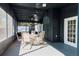 Relax on the large screened porch with ceiling fans and room for dining and lounging at 8436 Cameo St, Spring Hill, FL 34608