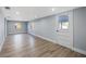 Spacious living room featuring recessed lighting, wood look flooring, and neutral paint at 9403 W Perio Pl, Tampa, FL 33612