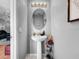 Bathroom featuring a pedestal sink, and modern fixtures at 14 Seagrape Cir, Clearwater, FL 33759