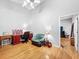 Bright bedroom with hardwood floors, vaulted ceiling, and ample natural light at 14 Seagrape Cir, Clearwater, FL 33759